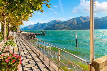 The lakefront walking path on the shores of Lake Como at the small village of Tremezzo, inside the town comune of Tremezzina, Italy.