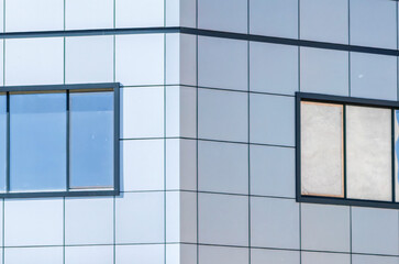 Symmetry in Modernity. Reflective Windows Frames Adorning a New Building Wall, architecture.