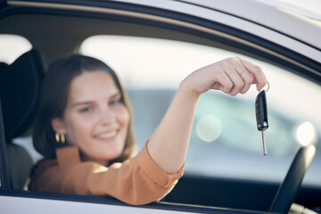 Portrait, woman and smile in car with keys as customer, driver and satisfied with purchase at dealership. Female person, vehicle and happy for payment, buying and savings for shopping and owner