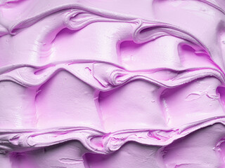 Frozen creamy bubble gum flavour gelato - full frame detail. Close up of a pink surface texture of...