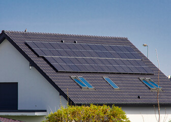 Roof of a private house in Europe with solar panels