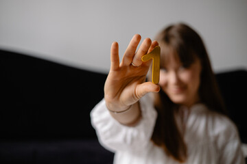 young woman holding numbers in her hands