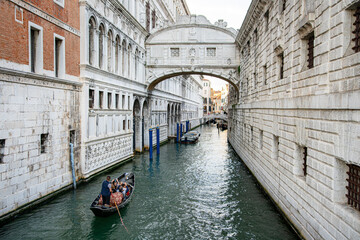 Venice, Italy: iconic spot with the Bridge of Sighs and a gondola on the canal Rio di Palazzo 