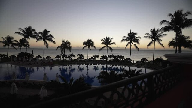 View of hotel pool at sunrise near Puerto Morelos, Caribbean Coast, Yucatan Peninsula, Mexico, North America