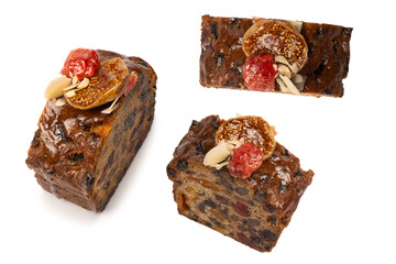 A cake with dried fruits, raisins almonds, dried strawberry.