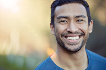 Portrait, fitness and happy man outdoor for workout, exercise or mockup space on morning lens flare...