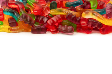 Assorted colorful gummy candies isolated on a white background.