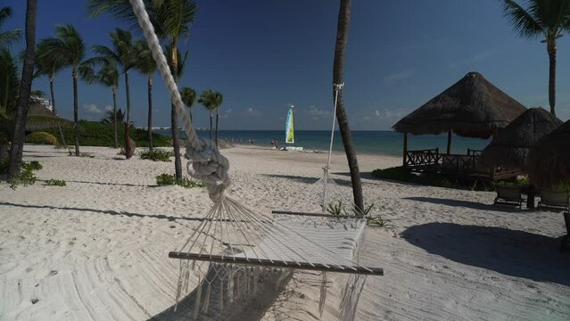 View of hammock, beach and sea near Puerto Morelos, Caribbean Coast, Yucatan Peninsula, Mexico, North America