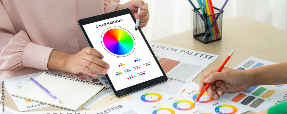 Poster a cropped picture of professional designer selects the color by using color theory and comparing wit