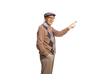 Happy elderly man holding a remote controller for AC unit