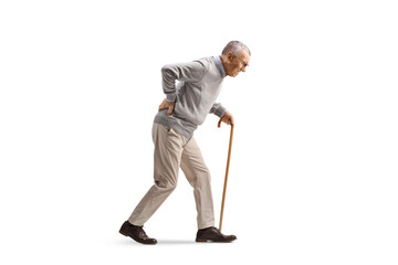 Full length profile shot of an elderly man walking with a bent back