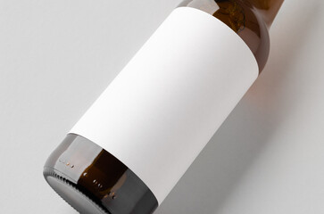 Amber beer bottle mockup with a blank label, closeup.