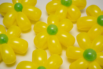 yellow daisies from balloons on a white background