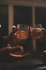 Celebration night, pour whiskey into a glass. Give to friends who come to celebrate
