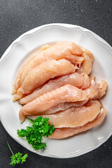 raw chicken meat aiguillettes fresh cooking appetizer meal food snack on the table copy space food...