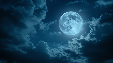 Full moon in the night sky with stars surrounded by dramatic clouds.