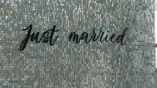 Wedding wall decor with moving elements and the inscription Just married.