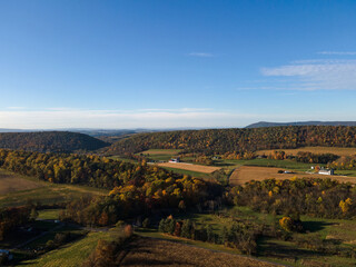 Naklejka premium Aerial landscape of corn field farmland in the Appalachian mountains in rural Central Pennsylvania