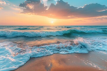 Sunset over the ocean with waves crashing onto a sandy beach. - obrazy, fototapety, plakaty