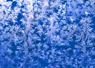 Frosted glass blue texture, winter window ice background. Frosty glass ice backdrop ultra-navy blue...