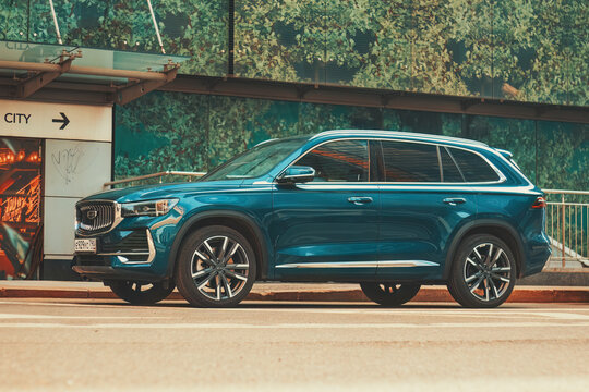 Blue car Geely Monjaro or Geely Xingyue L on chinese market, parked on city street