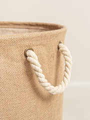 Jute basket for storing laundry, clothes, toys. Rope handle closeup