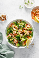 Shrimp avocado salad with lettuce and arugula, top view. - 794335423