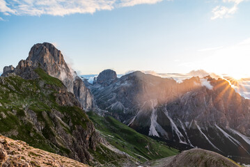 Sunrise from Passo delle Coronelle in Catinaccio mountain group in Dolomites mountains in Italy