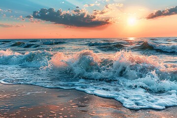 Beautiful sunset over the ocean with waves crashing on the sandy beach.