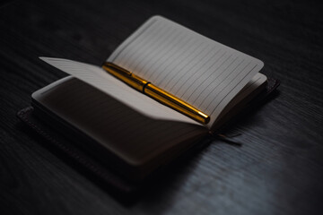 Subject shooting - Notepad and gold pen