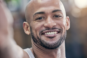 Selfie, headshot and portrait of black man in gym for workout, fitness and training with smile for progress. Happy, closeup and athlete in building for wellness, health and exercise for sport