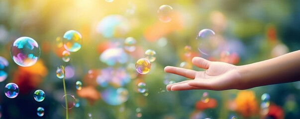 Energetic photo of a kids hands popping bright, colorful bubbles, filled with fun and a harmonious outdoor setting - obrazy, fototapety, plakaty