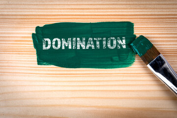 Domination. Green paint and paint brush on wood texture background - 794351805