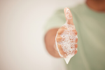 Person, hand or thumbs up for cleaning good job or maintenance for germ protection or bacteria....