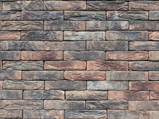 Close up of a colorful and textured brick wall