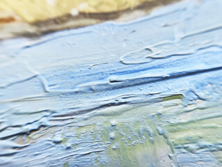 blue brush strokes of oil paint on an artistic canvas