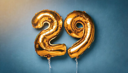 Banner with number 29 golden balloon. 29 years anniversary celebration. Bright blue background.
