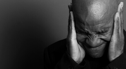 deaf man suffering from deafness and hearing loss on gray background with people stock image stock...