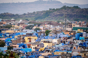 aerial drone shot showing jodhpur blue city cityscape showing traditional houses in middle of...