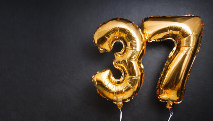 Banner with number 37 golden balloon. Thirty seven years anniversary celebration. Black background.