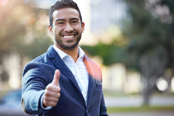Asian man, portrait and thumbs up to agree in city, thank you and motivation for worker in...