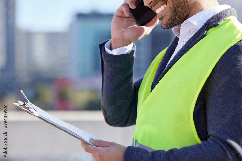 Canvas Prints Man, engineer and clipboard on call in construction site with mobile phone, smile and confident. Male person, project leader and hardhat in Dubai for building, architecture and development in city