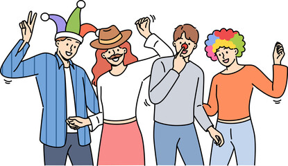 Group of friends participating in masquerade with funny hats or fake mustaches, dancing and enjoying festive party. Young men and women enjoy relaxing together at student party after end of session.