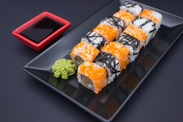 Sushi Composition with Soy Sauce and Wasabi on Dark Background