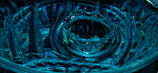 Water drop closeup while drops falling down and splashing into water in Jena
