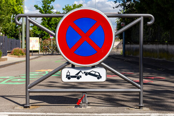 No stopping and no parking sign in a french street. Removal of vehicles. Parking strictly...