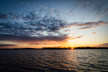 Beautiful April sunset over the lake