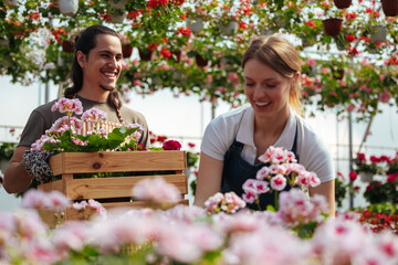 Happy gardeners working with flower crate