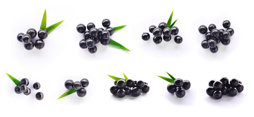 Acai berries with leaves on isolated white background. Top view © Andre
