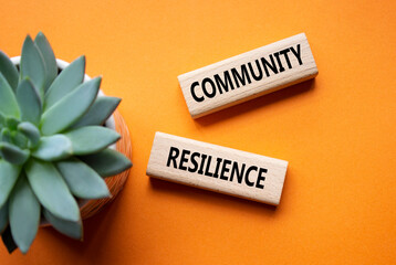 Community Resilience symbol. Wooden blocks with words Community Resilience. Beautiful orange...